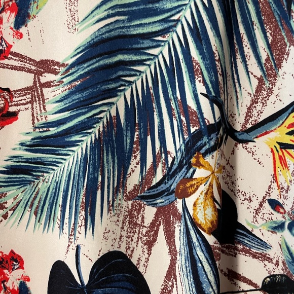 V neck short sleeved shirt in tropical print on a white background. - Picture 2 of 6